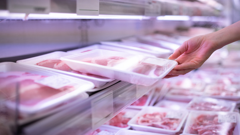 Raw pork chops in a store display