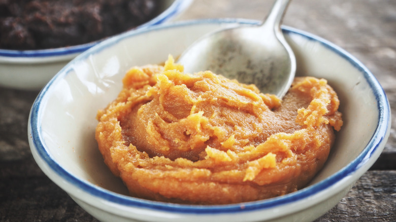 Miso paste with a spoon in a bowl