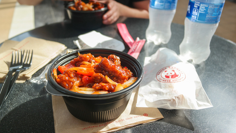 Panda Express bowl with orange chicken on a table