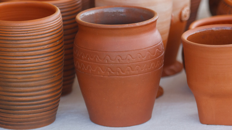 Rows of neutral crocks.