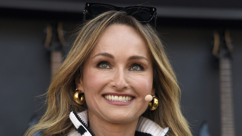 Giada de Laurentiis wearing white jacket, smiling