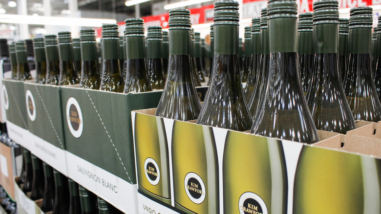 Bottles of Kim Crawford wine lined up on a retail shelf