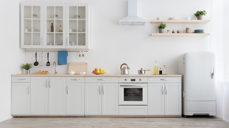 small apartment kitchen decorated in white