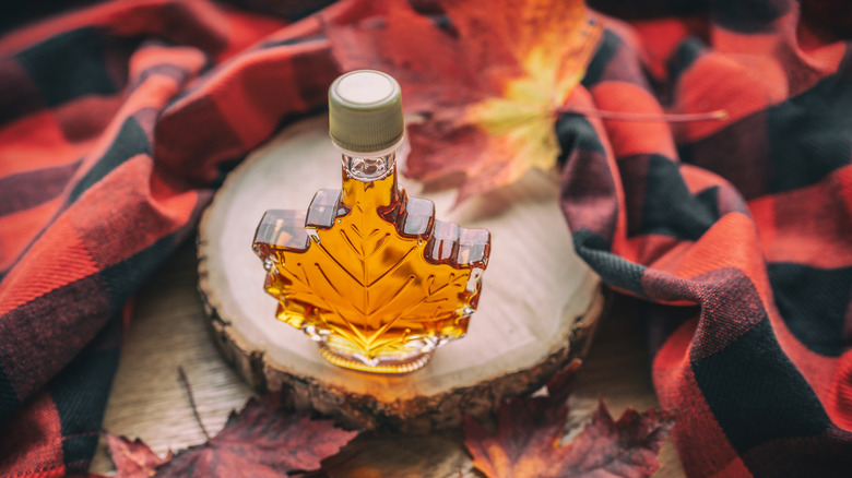 maple syrup in a maple leaf glass