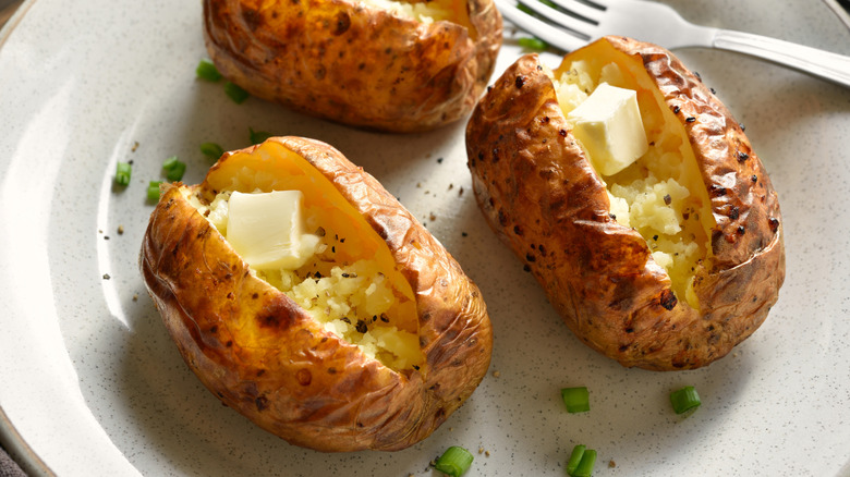 Baked potatoes with butter.