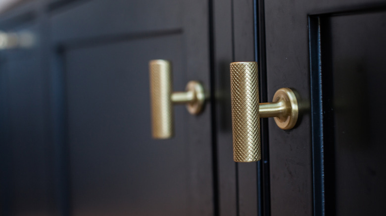 Cabinets with golden decorative pulls