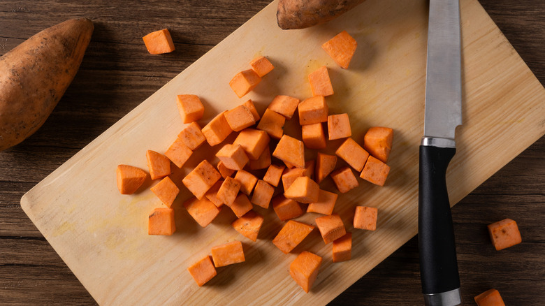 Diced sweet potatoes on a cutting board