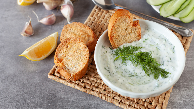 Tzatziki sauce in a white bowl.