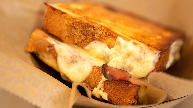 Side view of Texas toast grilled cheese sandwich with bacon