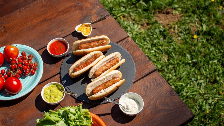Hot dogs on a picnic table