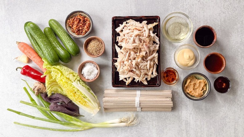 Chilled soba salad with leftover rotisserie chicken ingredients on countertop