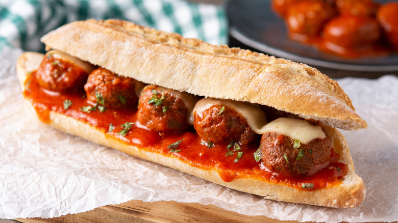 Meatball sub on a piece of white wax paper.