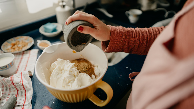 Woman mixing ingredients in a bowl