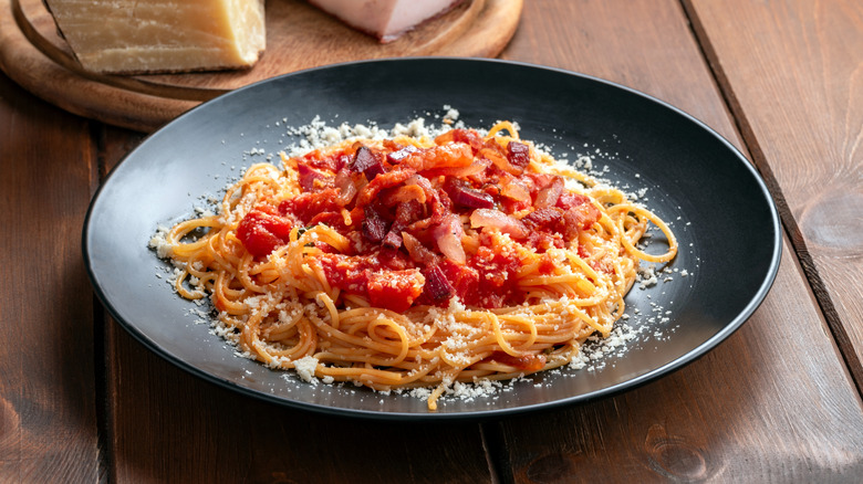 a plate of spaghetti in tomato sauce