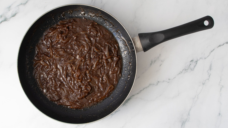 Dark sauteed onions in skillet