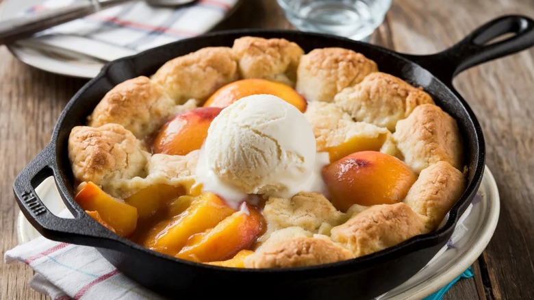 Peach cobbler in a cast-iron skillet.