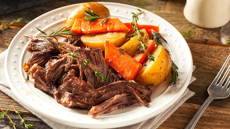Pot roast with carrots and potatoes.