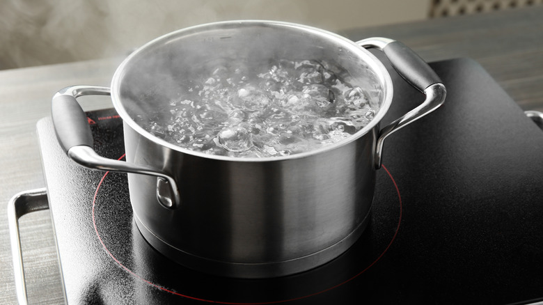 A cooking pot with boiling water.
