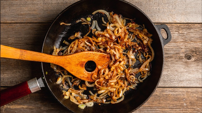 Caramelized onions in a pan with a spatula