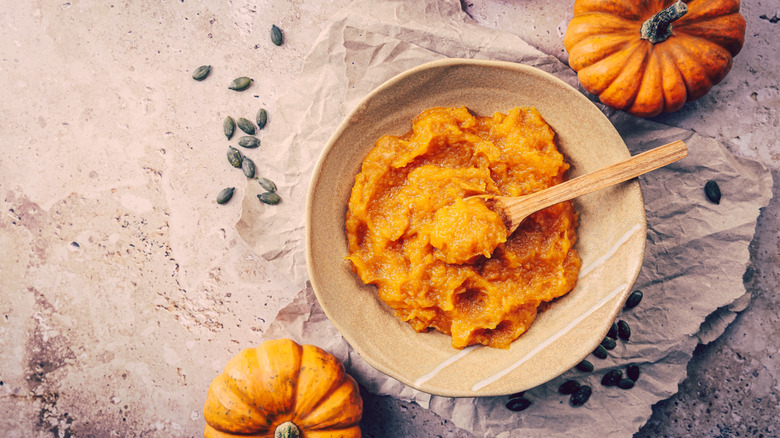 Organic orange pumpkin puree. Baked butternut squash, mashed pumpkin