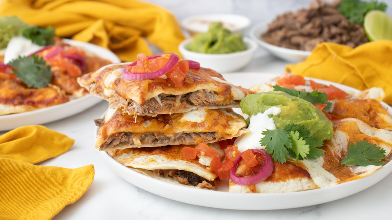 stacked slices of Mexican pizza