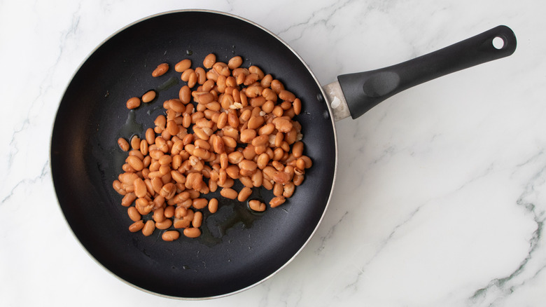 beans heating in skillet