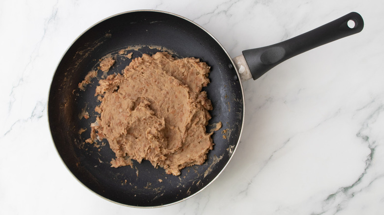 mashed beans in skillet