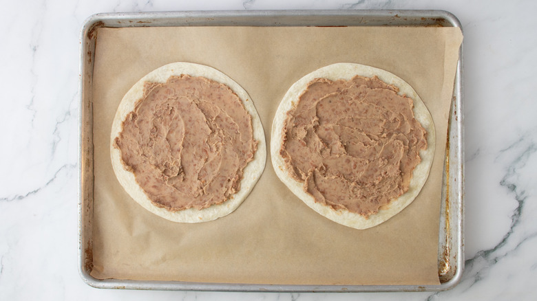mashed beans spread on tortillas