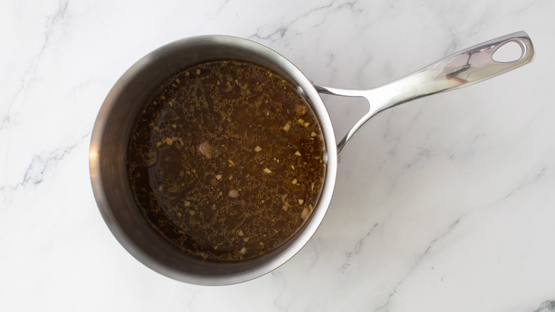 simmering pan drippings in saucepan