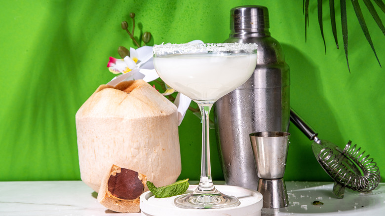 Coconut tequila cocktail in coupe glass