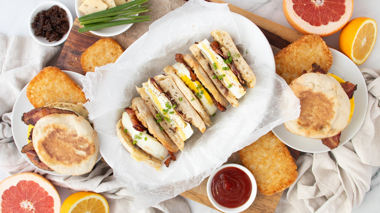 sliced egg and bacon sandwiches on English muffins