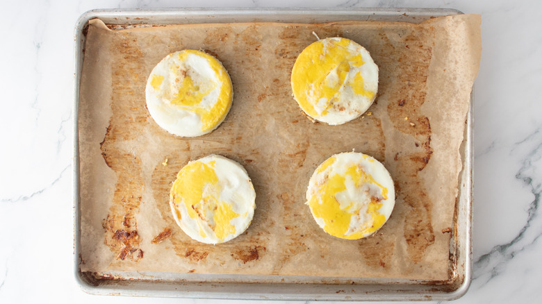 circular egg patties in a baking pan