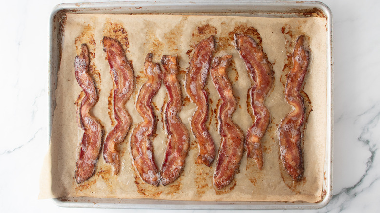 cooked bacon in a baking pan