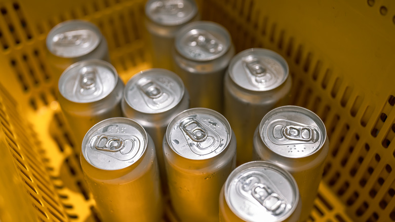 Top view of soda cans in a basket