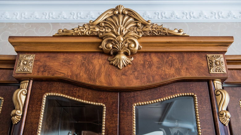luxury cupboard with a decorative pediment on top
