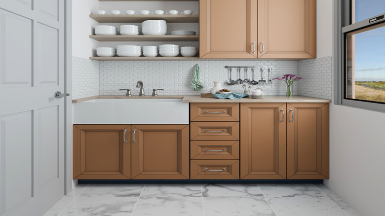 compact kitchen with beige cabinets