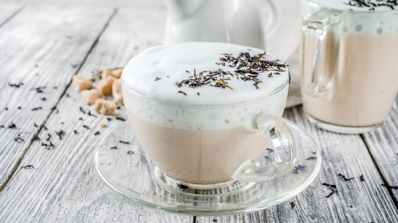 frothy earl grey latte in a glass mug