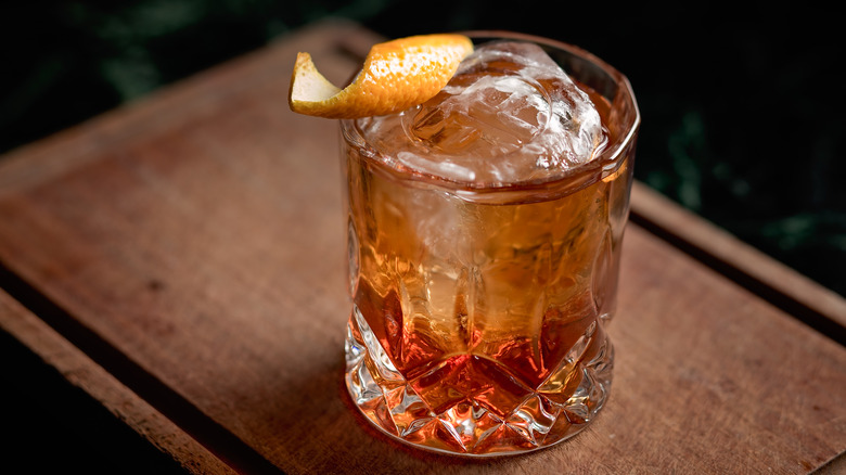 Old fashioned cocktail orange garnishing