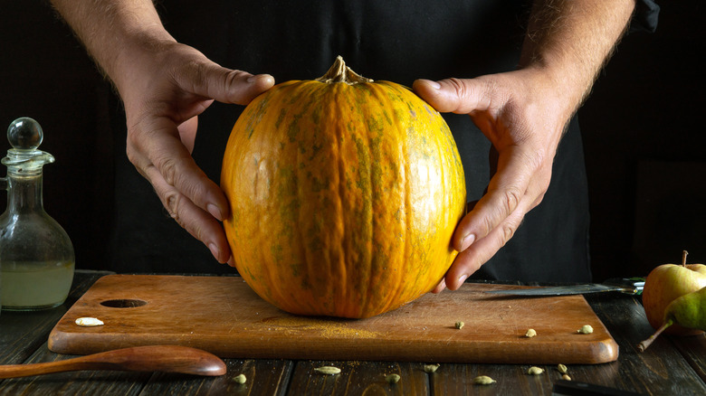Chef holding pumpkin