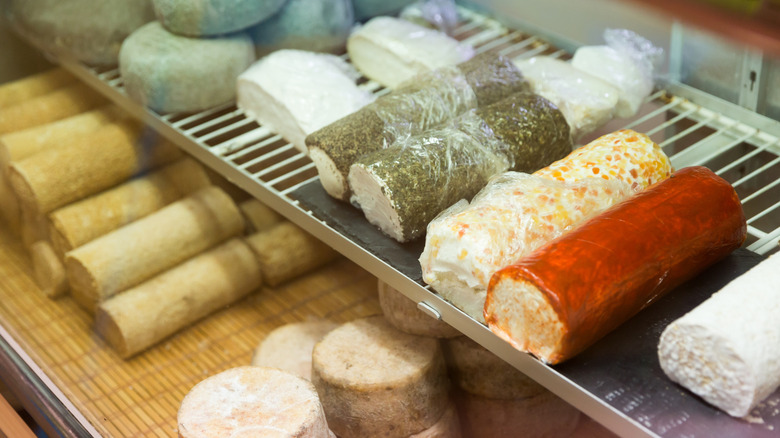 goat cheese on display in shop