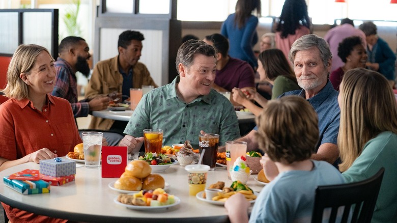 Group of people eating plates of food at Golden Corral