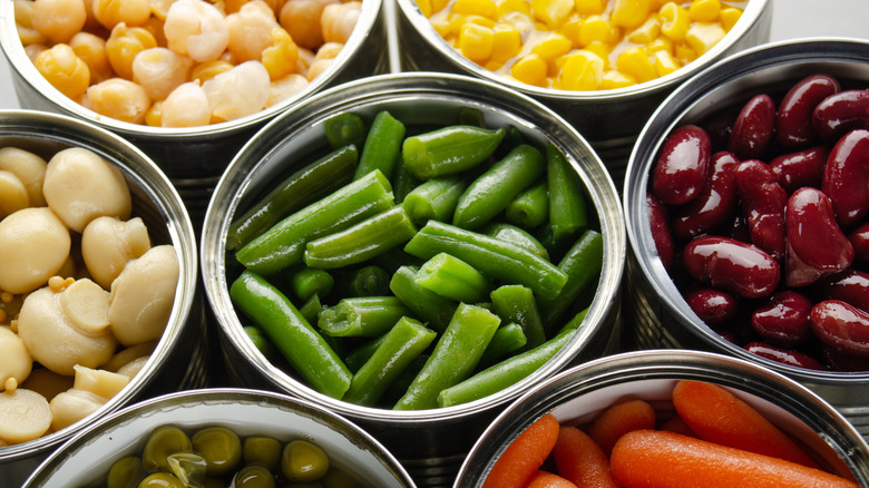 Canned veggies, including mushrooms, green beans, corn, garbanzo beans, green peas, and carrots.