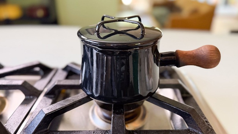 Small black sauce pan on stovetop