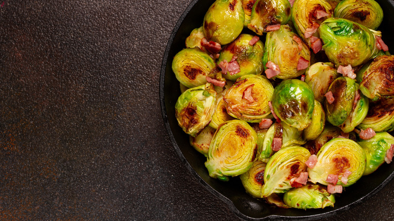 Brussel sprouts with pancetta in a cast iron pan