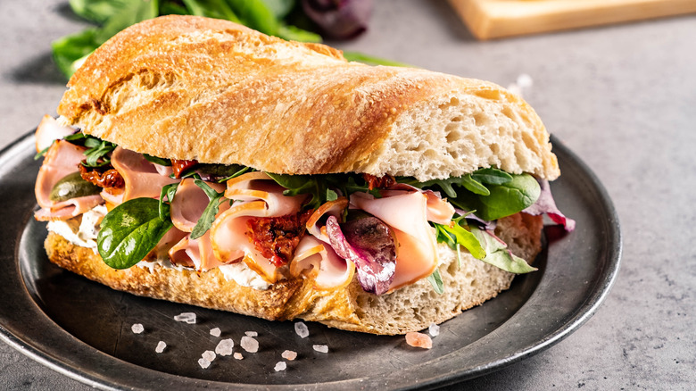 Ciabatta sandwich on dark plate