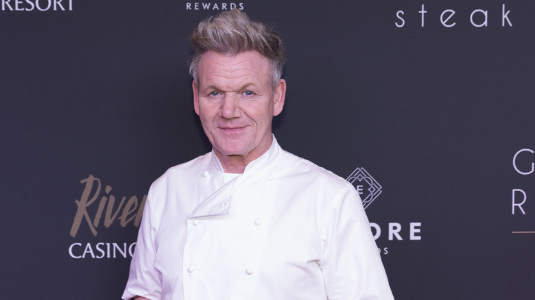 Gordon Ramsay smiles on a carpet