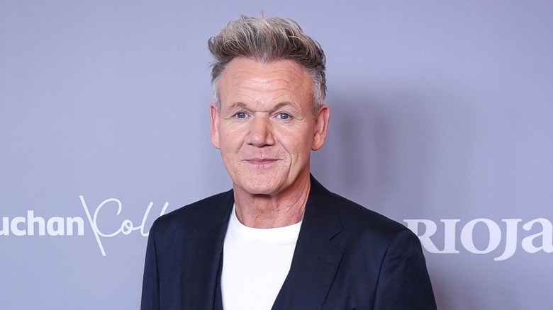 gordon ramsay poses for a picture at an event