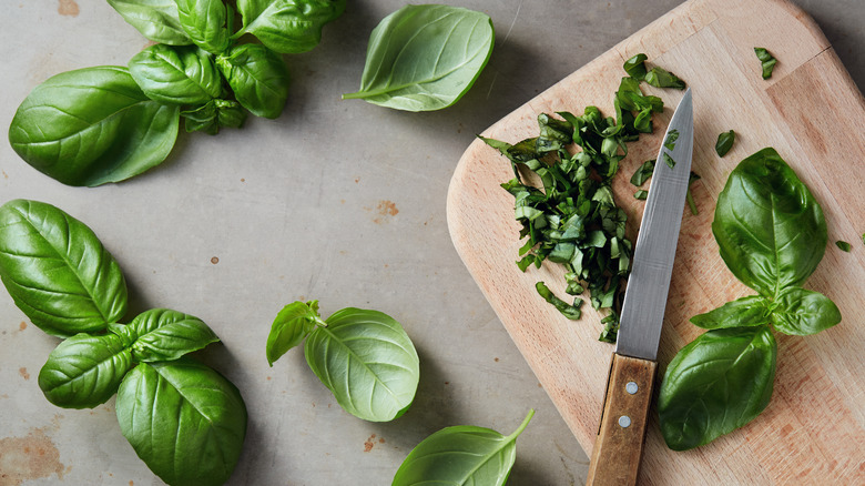 cutting board with chopped basil