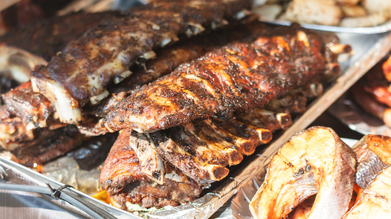 Ribs are piled on a tray.