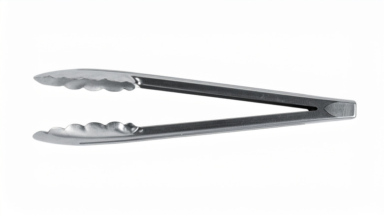 stainless steel tongs white background